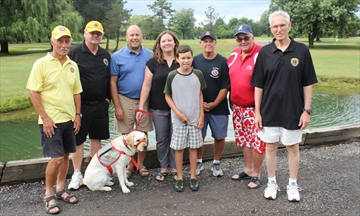  The Ridgeway Lions will be hosting a fundraising golf tournament on Sept. 11 at the Fort Erie Golf Club to help cover the cost of training service dogs. From left are: Lions members Ed Fenwick and Bruce Schinkel, Joe and Kim Ramos, their son, Joshua, with a service dog named Rex; Lions member Ron Brunner, Larry Gibson, owner of Fort Erie Golf Club, and Lions member Chuck Goodyear.  